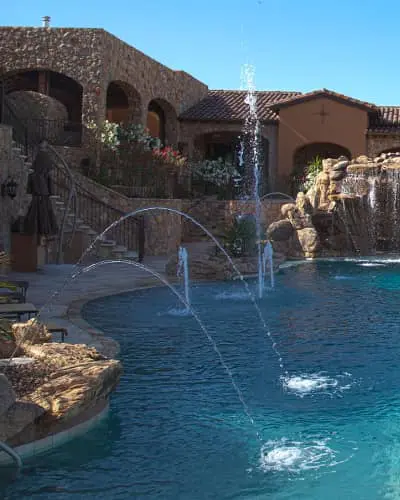 a pool with water jets in the air