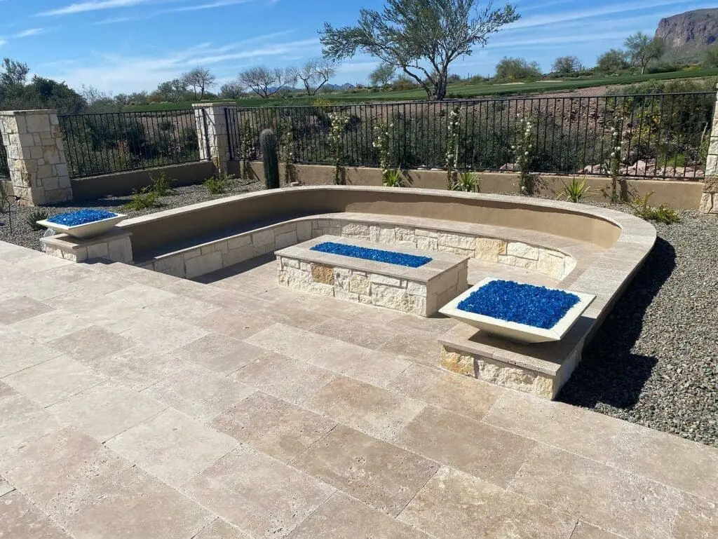 a stone patio with blue and white stones