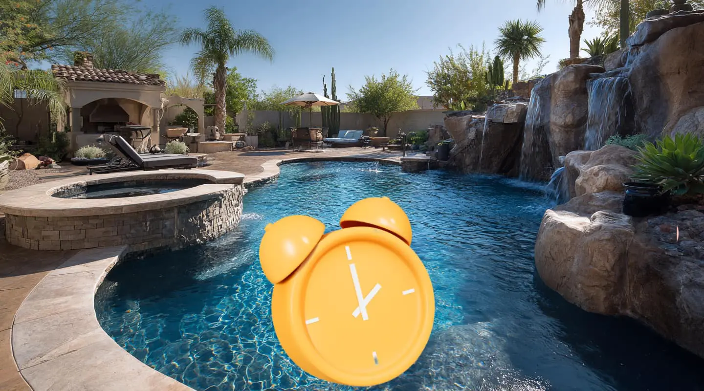 pool, spa, rock waterfall, palm trees with alarm clock on top, concept of how long does it take to build a pool in Mesa AZ
